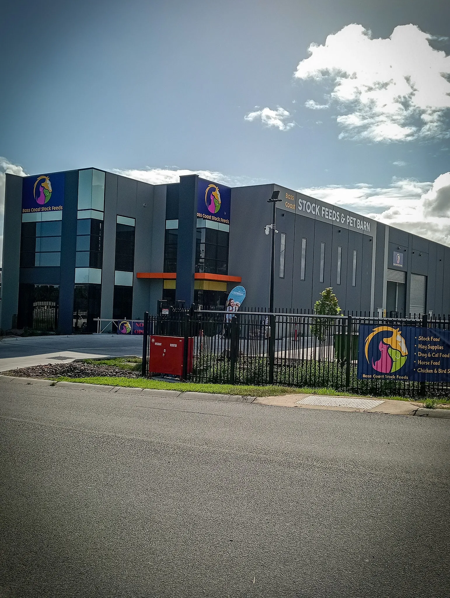 Bass Coast Stock Feeds full building exterior with product category banner signage